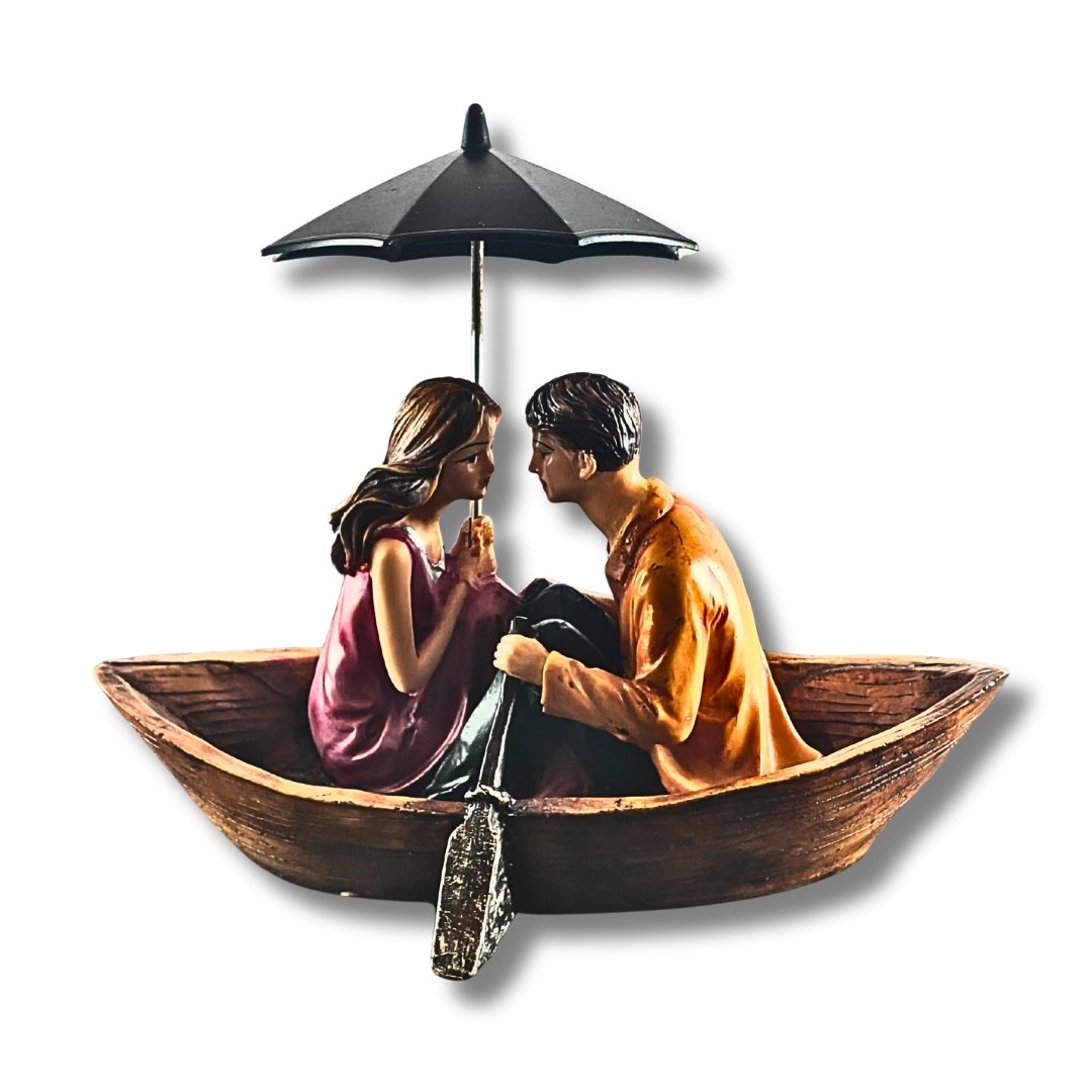 Romantic Couple Showpiece in Boat with Umbrella - Saadhya Mart Orange Front View